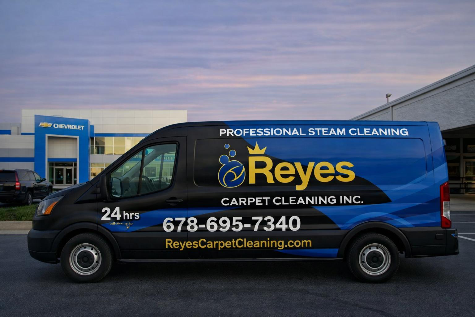 Reyes Carpet Cleaning van in a suburban neighborhood at sunset
